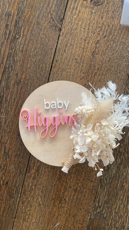 Baby name announcement with dried flowers